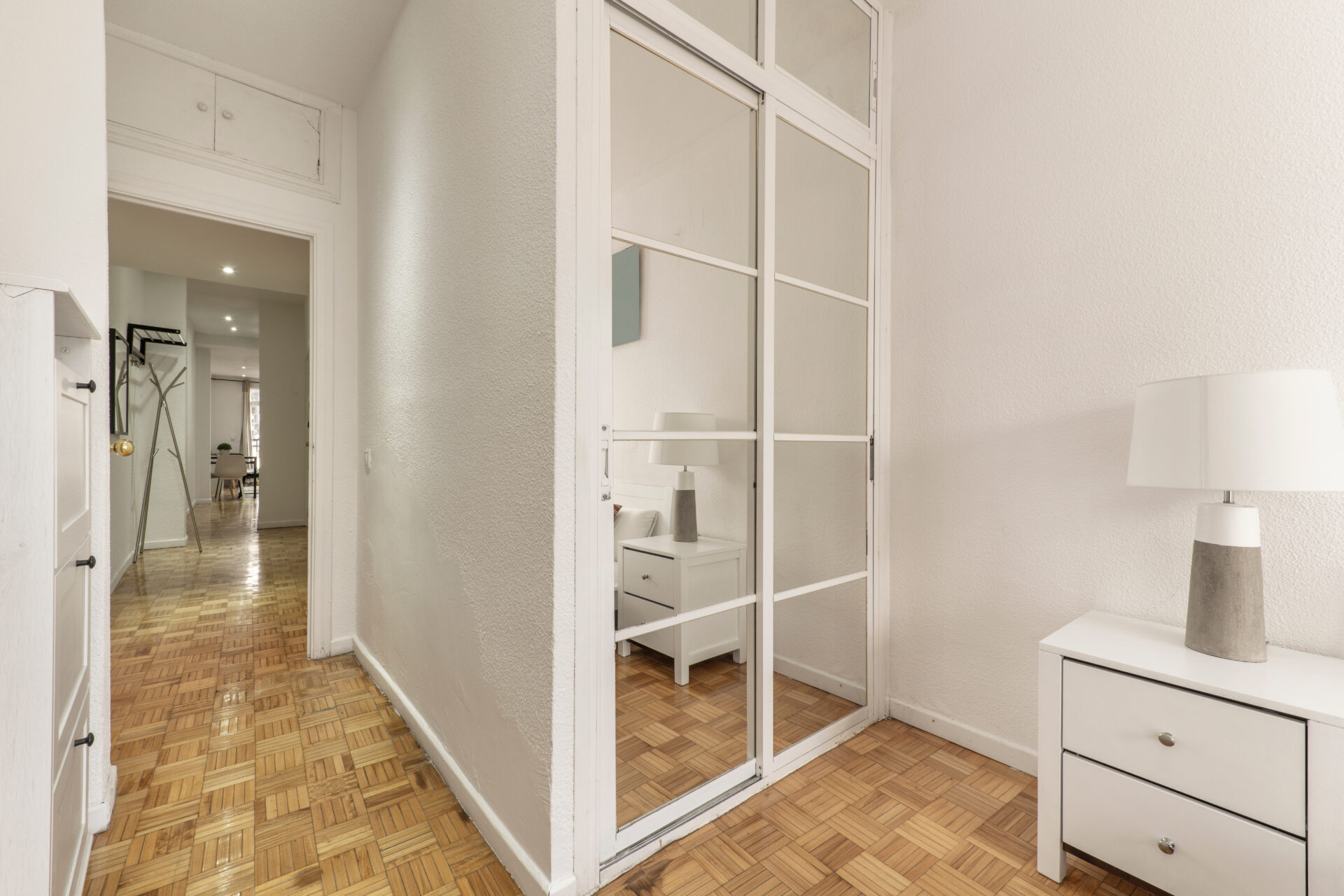 fitted bedroom with mirrored wardrobe
